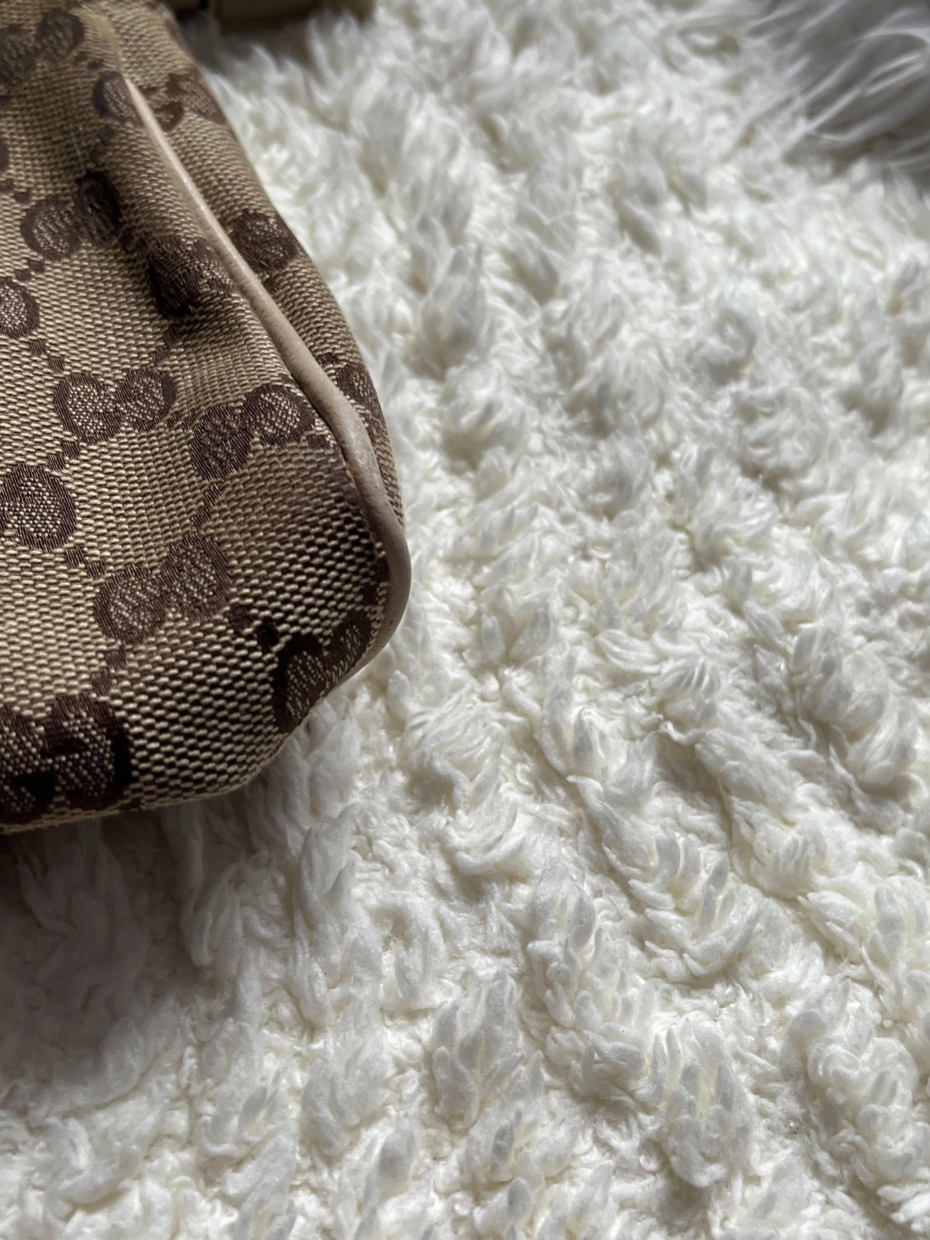 Sac/pochette Gucci en toile GG